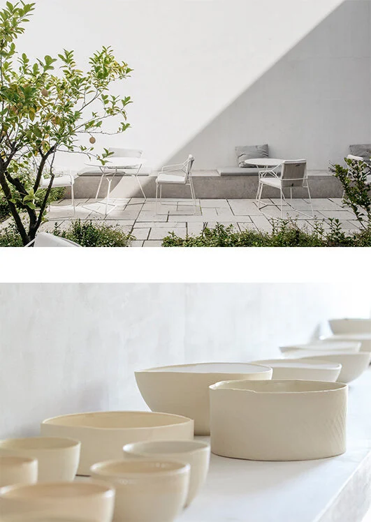 In the upper frame, white patio paving, wire-frame chairs, and bench cushions sit below a sharp sun shadow; below, cream ceramic bowls line a white shelf.